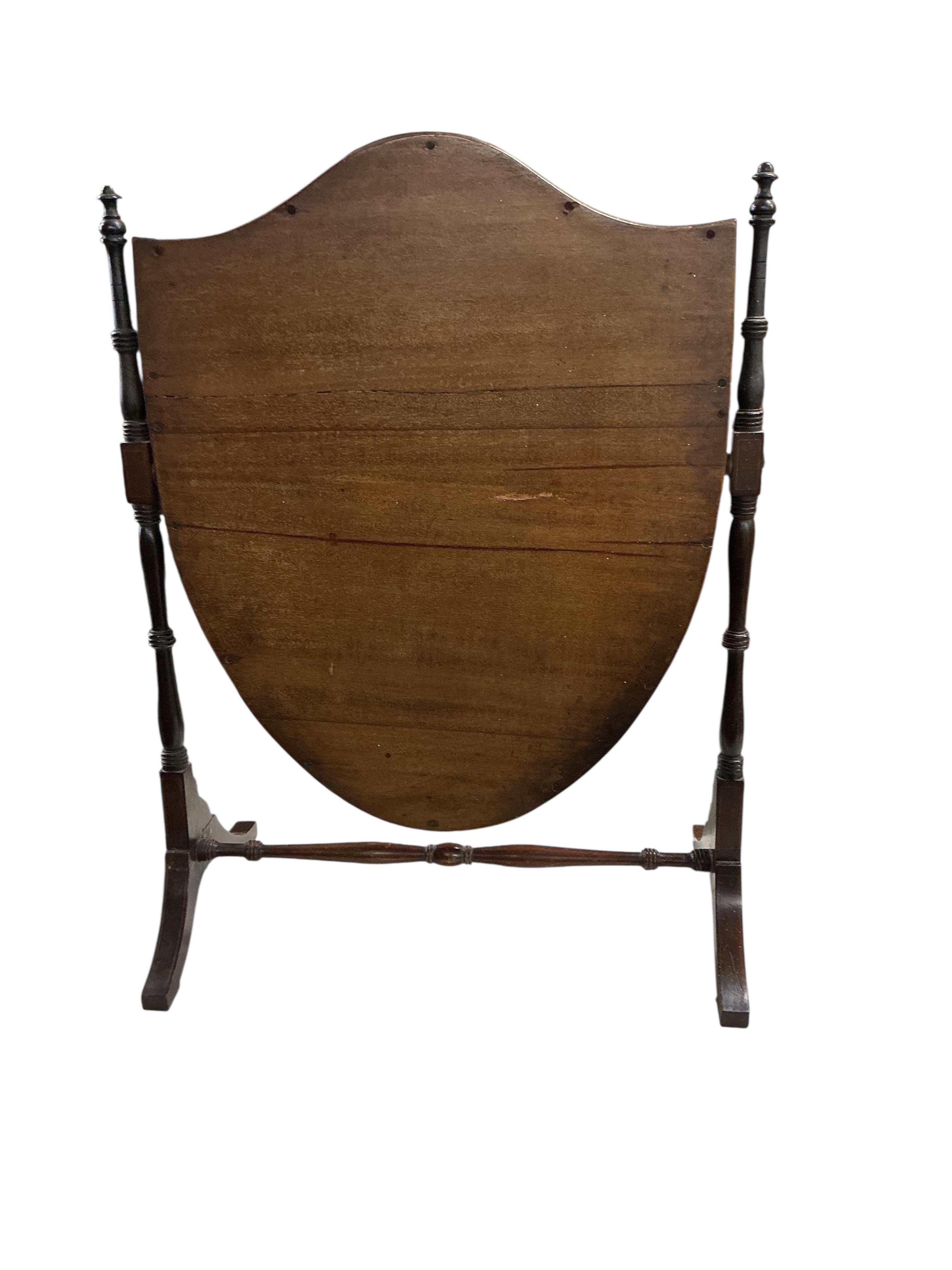 An Edwardian mahogany toilet mirror with shield shaped plate, width 52cm, height 66cm
